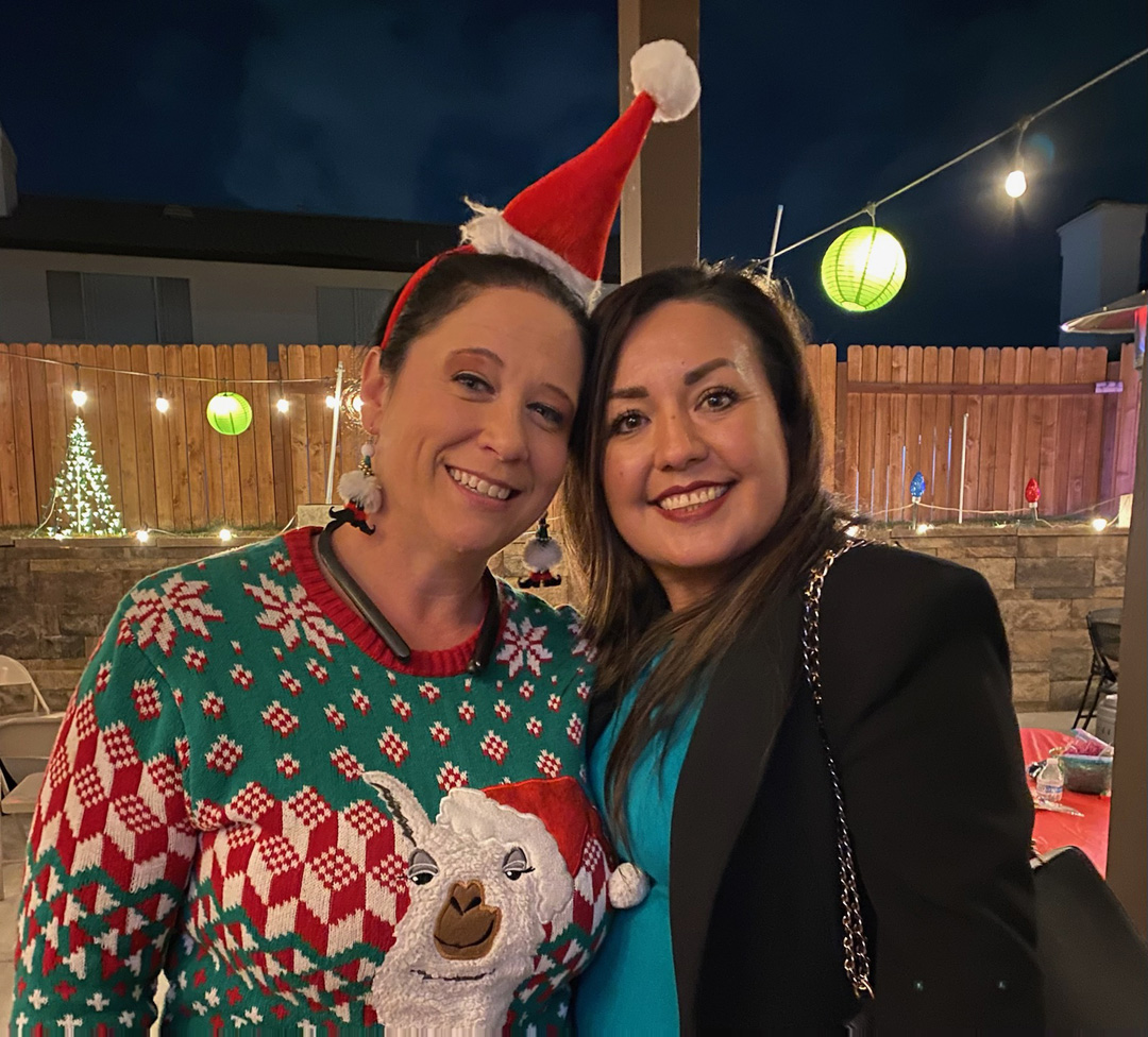 Friends smiling together at the Ladies Christmas Social