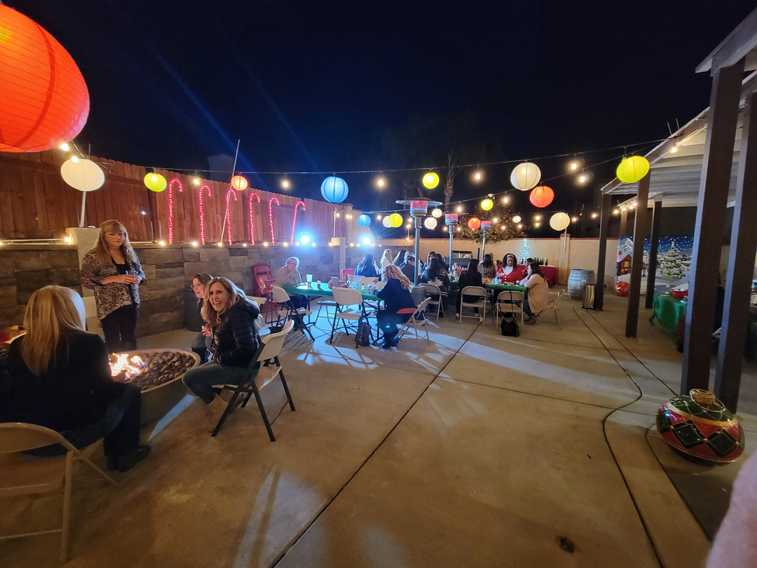 An early Ladies Christmas Social beneath festive Christmas lights