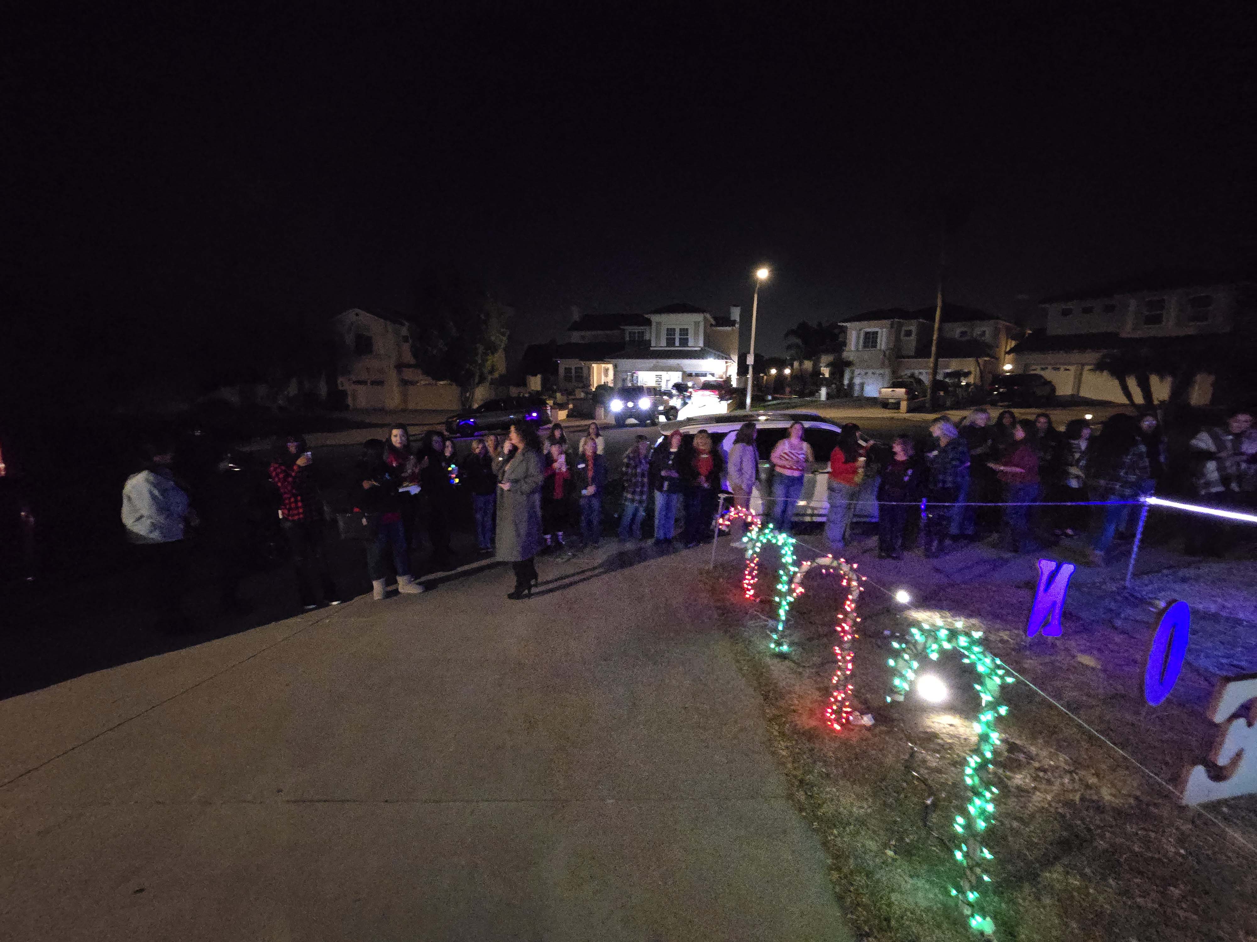 Ladies Christmas Social guests gathered under Christmas lights